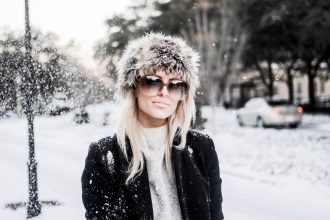Snow Bunny in Charleston SC king street January 4th 2018 faux fur hat oversized sunglasses thigh high boots H&M forever 21 black coat high neck sweater Charleston Fashion Blogger Dannon Like The Yogurt